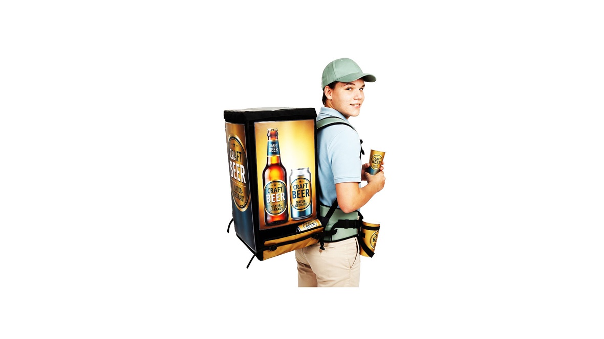 Group of promoters operating with professional beverage backpack systems for large-scale outdoor gatherings.