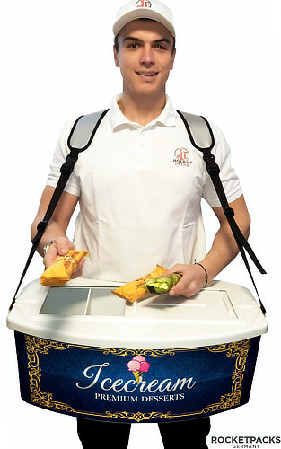 Promoter wearing a portable vendor tray with ice cream advertising and presenting packaged snacks for mobile product sampling.